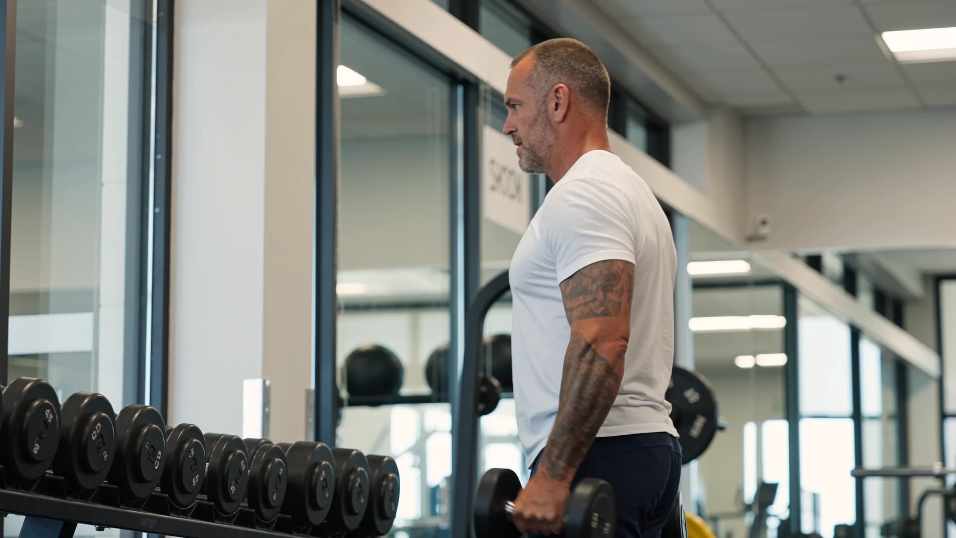 A person strength training in a modern gym